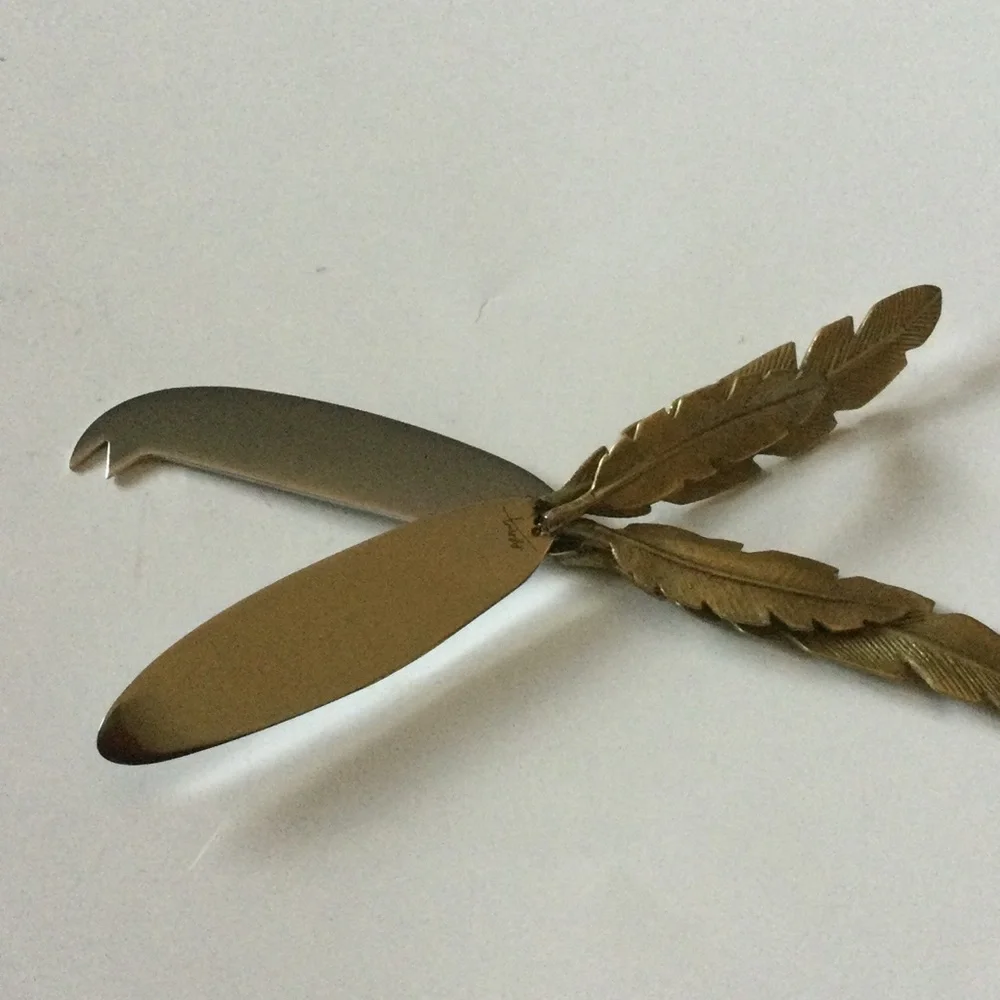 MICHAEL ARAM SET OF 2 FEATHER HANDLED CHEESE KNIVES NWT